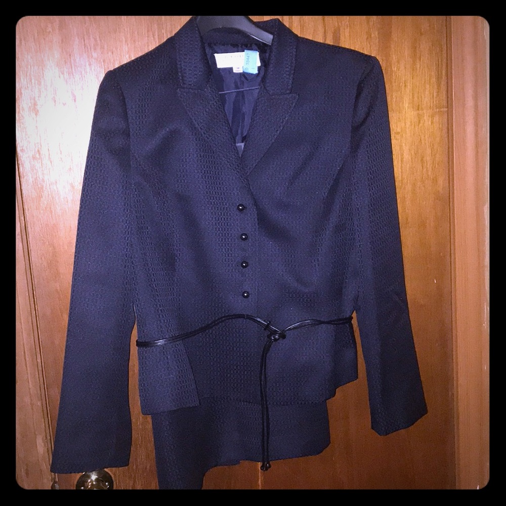 Navy business suit; jacket and skirt